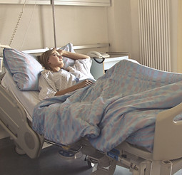 photo-of-woman-lying-in-hospital-bed-376